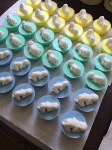 Blue, green & yellow pastel baby cupcakes